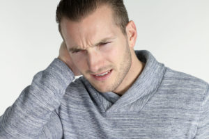 Man experiencing painful headache