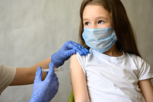 Girl receiving flu shot