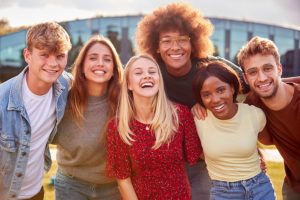 Group of smiling college students on campus